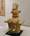 倚座の男子