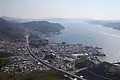 呉市天狗城山から南西方向の天応および江田島を望む。呉湾(K)。指定海域。