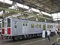 ラインカラーが剥がされホホ紅、方向板フックが復元され登場時の姿に戻った60系6014号車 （2015年11月3日/おおさか市営交通フェスティバル特別編in森之宮にて）