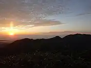頼母木小屋から見た日の入りと朳差岳