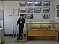 旧江差駅資料展示館・地域交流館の館内展示-1（2019年5月撮影）駅員の制服、江差線開通当時・江差駅開業当時・江差線ファイナルイベントの各種写真、駅の備品など