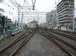下り方面の平面交差。左側が天下茶屋方面、右側が大阪梅田方面（2007年8月）