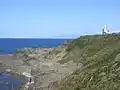 江差町鴎島・鴎島灯台の裏側、この中腹あたりに「弁慶の力石」があったと伝えられている