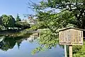 鹿沼公園内白鳥池。でいらぼっち伝説の碑がある
