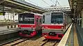 国鉄205系BUD69編成（元クラH9編成）とTM 6000 6119編成がマンガライ駅に到着