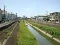 第二寝屋川博養橋より下流を望む。見える橋は山我橋。山我橋の右岸に見えるのは若江中学校。