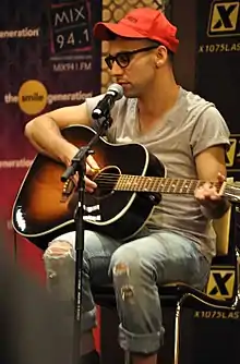 Man performing with a guitar