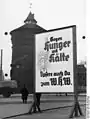 1936年、ニュルンベルクに掲示された看板。「空腹と寒さに立ち向かうため、あなたもWHWへ寄付を」と書かれている。