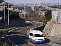 中津東部・小沢ルート用のマイクロバス（旧塗色）トヨタ・ハイエース（あ200号車）