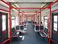 昼の車内奥に行先表示LEDが見える
