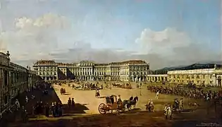 ベルナルド・ベッロット(カナレット)画(1758/61年)。側面（右端）の建物は典型的なシェーンブルン・イエローであるのに対し、中央の主要部は変化に富んだバロック風のイエローとなっている。