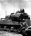 クェゼリンの戦いで撃破され、M4中戦車の背中に乗せられた九四式軽装甲車(後期型)