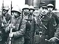 日本占領地区に点在した皇協軍の一つと思われる不明部隊。日本式の略帽を被り、ヘルメットは90式とドイツ式が混在している
