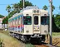 ラッピング広告車時代の2000形2002編成（2010年8月8日）