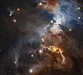 星雲内の恒星 HBC 672 を取り囲む原始惑星系円盤によって作られた影。