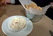 Crab dip accompanied by chips served in a restaurant