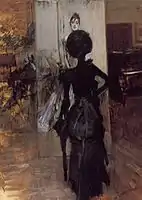 自分の肖像を見つめる黒いドレスのエミリアーナ、1888年