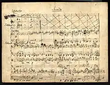 eleven-staved music manuscript sheet written in black ink, headed 'Secondo'