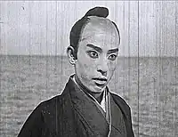 片岡紅三郎 - 早水源三郎（家老の息子）