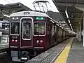 箕面駅停車中の7000系7015F（8両編成）による準急梅田行き。現在は廃止された箕面線内の準急。