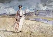 砂浜を歩く女性(c.1910)
