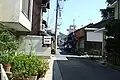 I.特に道幅が狭い地点。歩行者も多いため徐行して進むことになる。