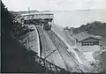 1889年頃、八ツ山橋から見る品川駅と海。跨線橋は1882年設置 の物か。