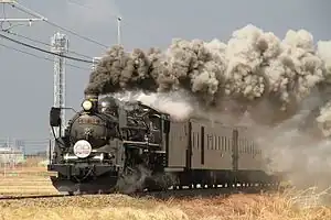 SL村上ひな街道の牽引機として走行するC57 180（2014年3月）