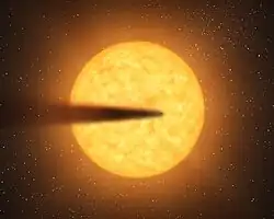 主星の周囲を公転するケプラー1520bの想像図。惑星は表面の昇華によって急速に質量を失い、塵の尾を引いている。