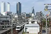 名古屋の街を後に大阪を目指す21000系(米野駅 - 黄金駅間)