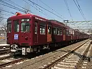 1000形1321編成「京急110年の歴史ギャラリー号」。ニス塗りの木製ドア、リベット、シル、ヘッダーなどが印刷で表現されている(2008年3月22日 新町検車区)