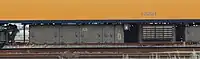 従来の電動カム式抵抗制御装置(左側の機器)。1C4M制御方式で180kWの電動機4台を制御する。