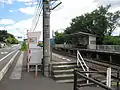 榎井方入口 左手の県道上に「丸亀市」の標識（2010年8月4日）
