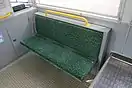客室座席。左からクロスシート部分・ロングシート部分・折りたたみ座席部分。左のみ2次車 (9703)、他2枚は3次車 (9704) で撮影。（2016年）