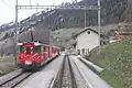 標準的なシャトルトレインの編成で区間列車を牽引するDeh4/4 51-55形、ミュスター駅、2012年