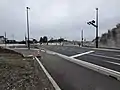 2021年2月27日時点の都城志布志道路と県道63号（一般道）との接続点。