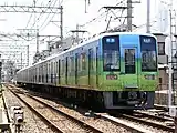 1001F なんばパークスラッピング（2006年7月 住吉東駅付近）