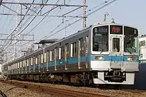 クヤ31形を牽引する1000形1051×4(2015年2月15日 / 読売ランド前駅 - 生田駅)
