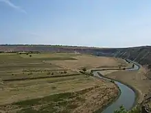 River winding past low farmland