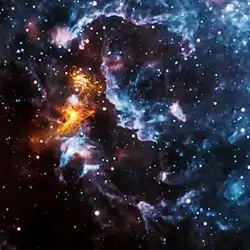 PSR B1509-58周辺の画像。チャンドラが観測したX線(黄金色)と、WISEが観測した赤外線(RGB)の画像を重ねたもの。出典: NASA / CXC / SAO(X線); NASA / JPL-Caltech(赤外線)