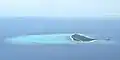 珊瑚礁に囲まれたパマリカン島の空撮画像。奥には左にアグタヤ島、右にクーヨー島が見えている。