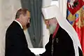 2006年12月21日。府主教（肩書当時）キリルと、ロシア連邦大統領プーチン（肩書当時）。