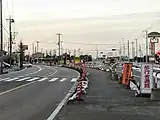 バイパス開通前の多門寺交差点付近。加須インターチェンジから羽生方面を望む。(2007年3月2日撮影)左:加須バイパス(当時の125号現道)、右:加須羽生バイパス