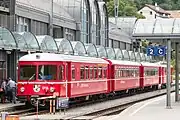新塗装、側面窓改造後も丸型前照灯のままであったABDt 1714号車とB 2417-2420形2両、Be4/4 511-516形の編成、テュシス駅、2011年