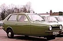 an early model reliant robin in olive colour