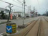 上屋設置前の越ノ潟駅方面のりば（2009年3月）