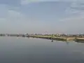 橋上より久留米市中心部を望む。