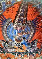 渦巻く火の光輪と神の怒りの性質を示す煙の柱に囲まれた多肢のチベットの神 (19世紀)。 (ハヤグリーヴァ(英語版)のタンカ)
