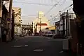 飛田大門跡。ガス灯を模した照明の附近に門の跡がある。