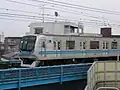 第30編成(9次車)の側面6 - 10次車はドア間隔が不揃いである(2006年4月30日 西船橋駅 - 原木中山駅間)